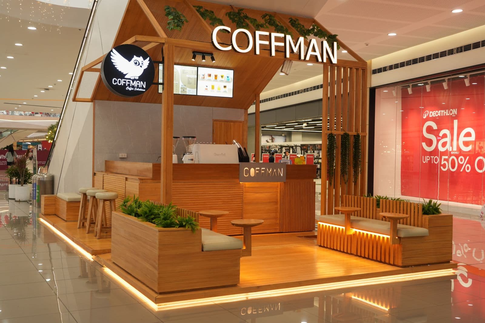 Coffman Coffee lounge area with upholstered bench seating and side tables