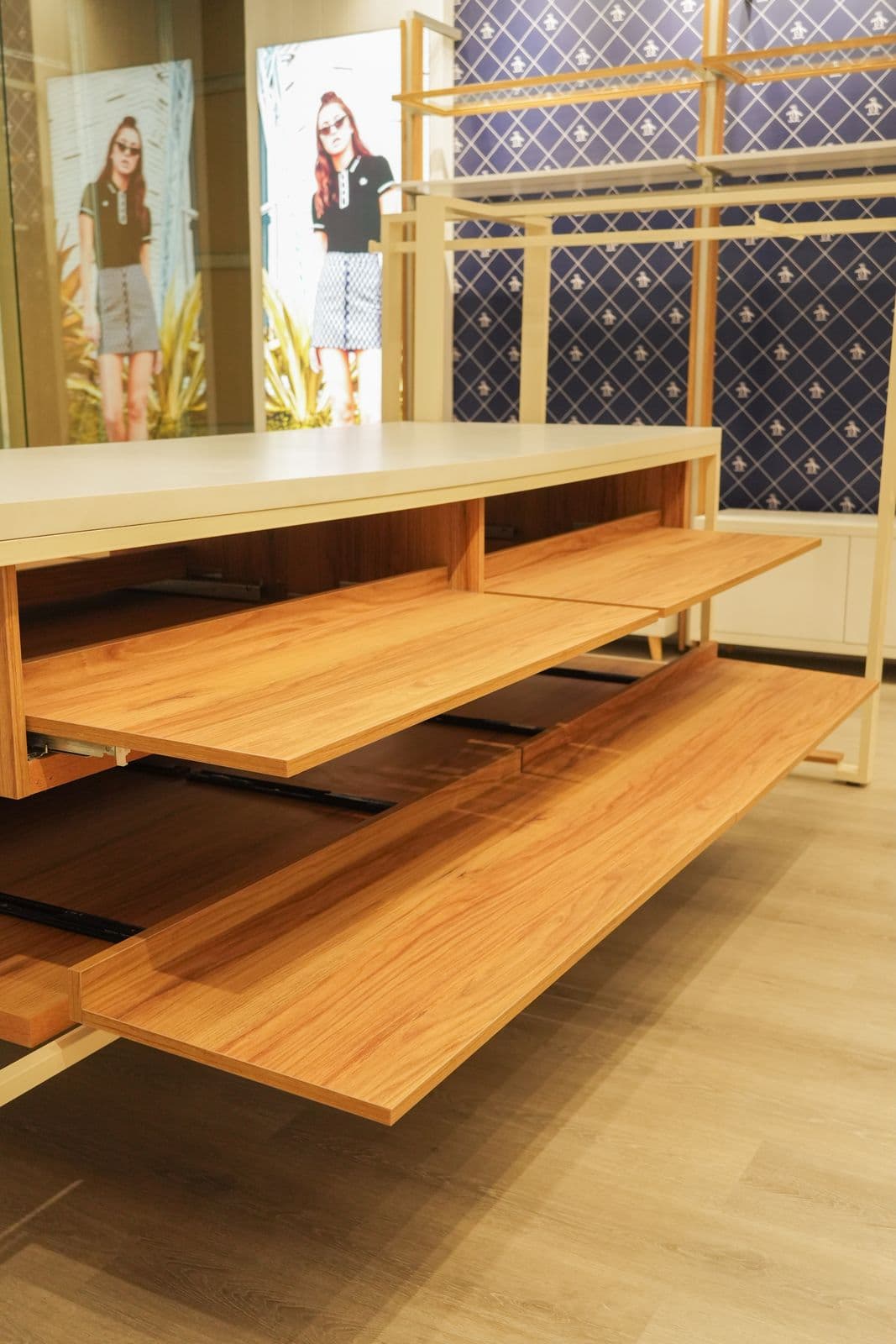 Original Penguin store interior with timber shelving, track lighting, and merchandise displays