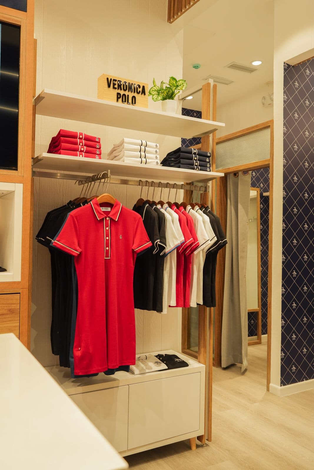 Wide view of Original Penguin storefront showing open floor plan layout